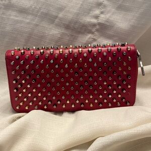 GUC - Christian Louboutin zip around dark pink wallet